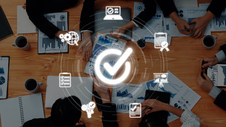 A diverse group of professionals collaborating in an office setting, utilizing data visualization tools and charts to enhance project planning and analysis. Rasterの写真素材