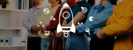 Dynamic scene of diverse professionals in an office setting, symbolizing teamwork and innovation, with a rocket icon representing growth and potential in the business world.の写真素材
