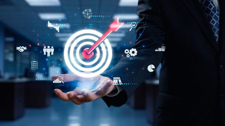 A businessman showcases a digital target in a modern office setting, surrounded by icons representing success metrics and strategy, emphasizing innovation and growth opportunities.の写真素材