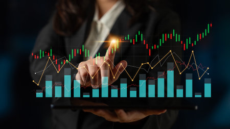 A business professional uses a tablet to analyze stock market trends, surrounded by financial graphs...