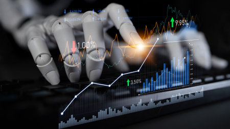 Enhanced technology in finance is represented by a robotic hand engaged with data on a keyboard, symbolizing the fusion of automation and financial analysis.の写真素材