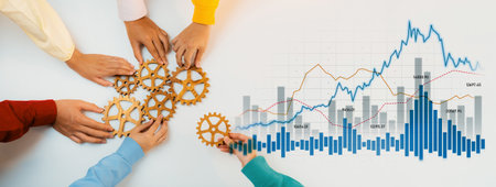 Diverse hands collaborate by arranging gears, symbolizing teamwork and innovation, while financial...