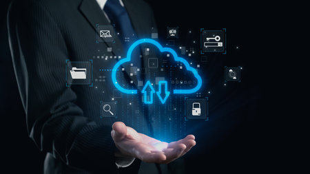 A business professional showcases innovative cloud technology with digital icons representing data...