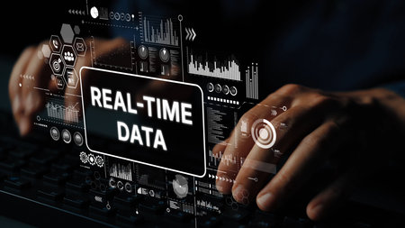 Hands Typing on a Keyboard with Real-Time Data Visualization and Analytics Background in a Modern Digital Environment. Asymptotic smart data analytic.の写真素材
