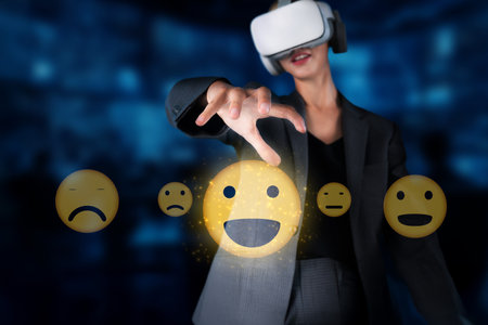 A professional woman engages with virtual reality while selecting emojis representing customer...