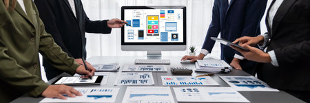 Panorama shot analyst team utilizing BI to analyze financial report with laptop. Businesspeople analyzing BI data dashboard displayed on laptop screen for business insight.の写真素材