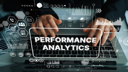 Professional Hands Typing on Laptop Keyboard with Performance Analytics Data Visualizations in...