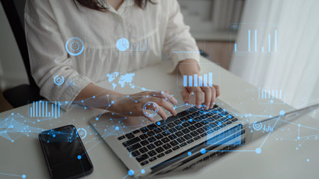 Woman Working on Laptop with Digital Graphs and Statistics Overlaid, Concept of Data Analysis and...