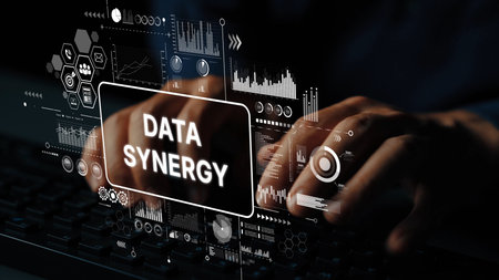 Conceptual Image of Data Synergy with Hands Typing on Keyboard Surrounded by Digital Graphs and Analytics Symbols. Asymptotic smart data analytic.の写真素材