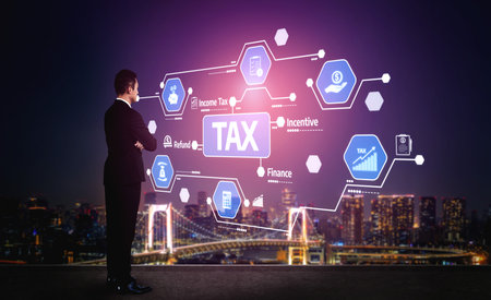 A businessman stands against a vibrant city skyline at night, analyzing digital tax concepts, focusing on income tax, incentives, and finance strategies through innovative graphics. Tesselの写真素材