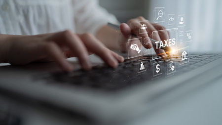 Concept of tax preparation and financial compliance. Filing official tax documents and forms for government reporting, auditing, and financial accounting purposes.の写真素材