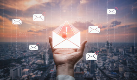 A cybersecurity alert indicating a phishing scam or malware threat. This dangerous email requires immediate action to protect against data theft and unauthorized system access.の写真素材