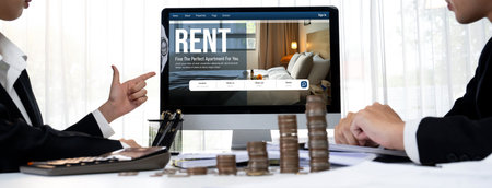 Online real estate rental search brisk on computer. House home or apartment rental website online.の素材