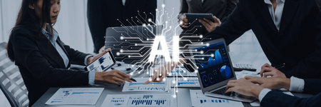 A group of professionals engages in a productive meeting, utilizing artificial intelligence tools for data analysis and innovative strategy development in a modern office setting.の写真素材