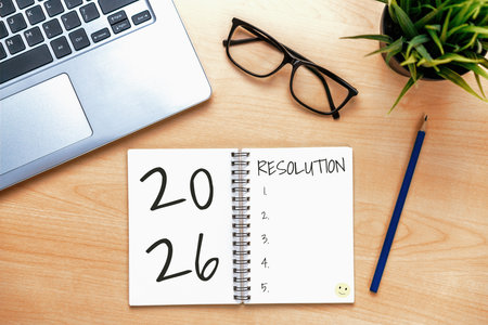 2026 Happy New Year Resolution Goal List and Plans Setting - Business office desk with notebook written about plan listing of new year goals and resolutions setting. Change and glee concept.の写真素材