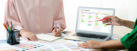 Project planning software for brisk business project management on the computer screen showing...