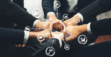 Collaborative Teamwork in Digital Marketing Strategy with Visual Icons Representing Analytics and Business Growth.の写真素材