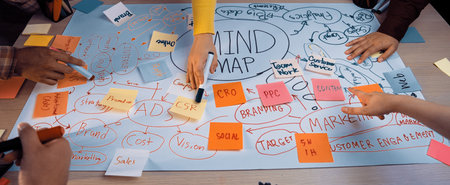 A vibrant workshop scene showing diverse hands actively engaging in a mind mapping session,...