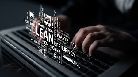 This image showcases the concept of lean management with keywords representing efficiency and productivity. A person hands interact with a keyboard, emphasizing modern business practices. Tesselの写真素材