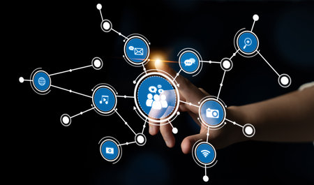 A hand reaches towards a network of digital icons representing various forms of communication and sharing, illustrating the interplay of technology in modern interactions and connectivity. Tesselの写真素材