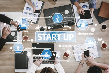 A dynamic business meeting focused on startup growth, featuring diverse professionals engaging in strategic planning, collaboration, and innovation. Tesselの写真素材