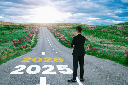 2026 New Year journey and future vision concept . Businessman traveling on highway road leading forward to happy new year celebration in beginning of 2026 for glee and successful start .の写真素材