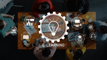 A dynamic scene depicting a group of individuals in an e-learning environment, showcasing interactive learning through technology and collaboration. Rasterの写真素材