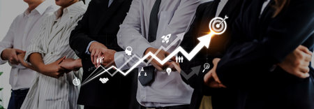 A confident team of diverse business professionals stands together in a modern office, symbolizing...