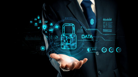A businessman presents a digital concept of data security featuring a lock symbol against a modern backdrop, emphasizing the critical importance of protecting information.の写真素材