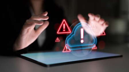Red alert triangles over a blue cloud icon, symbolizing cloud security threats, system warnings, and data protection risks in digital environments Parseの写真素材