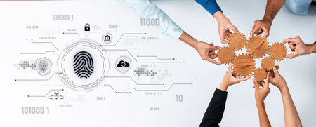 Hands coming together to assemble gears symbolize collaboration in a secure digital environment, highlighting teamwork, innovation, and strategy in technology.の写真素材
