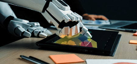 A robotic hand skillfully interacts with a digital tablet showcasing vibrant designs in a...