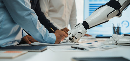 An engaging scene of collaboration in a modern office where human hands and a robot arm work...