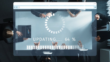 A group of business professionals collaborates on a digital project, showcasing a data update visually represented on a transparent screen in a modern workspace. Rasterの写真素材