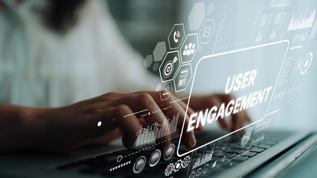 Hands Typing on Laptop with Digital User Engagement Concept and Graphic Interface Overlay in Modern Workspace. Asymptotic smart data analytic.の写真素材