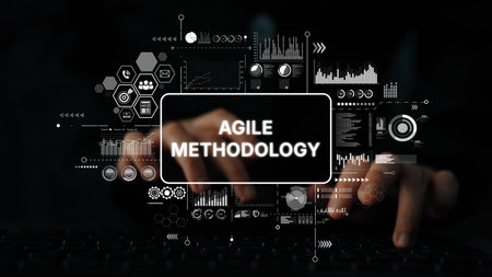 Hands Typing on Keyboard with Visuals Representing Agile Methodology in a Dark Environment. Asymptotic smart data analytic.の写真素材