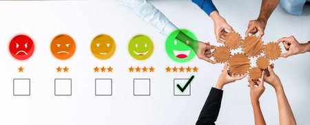 A diverse group of hands reaching for smiley icons and checkboxes to symbolize customer feedback and satisfaction, representing teamwork and engagement in a business setting.の写真素材