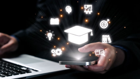 A business professional engages with a smartphone, exploring digital learning concepts represented by icons, showcasing modern education and technology integration.の写真素材