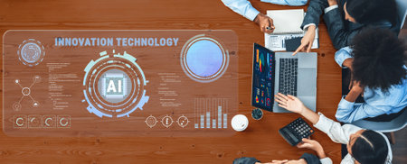 A top-down view of a professional team collaborating on artificial intelligence innovation, featuring data visualization and strategic planning in a modern office environment.の写真素材