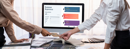 Group of interior architect designer team at table choosing various mood board samples with architecture software on laptop screen. Modern renovation and interior material selection concept. Insightの写真素材