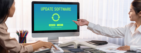 Group of interior architect designer team at table choosing various mood board samples with architecture software on laptop screen. Modern renovation and interior material selection concept. Insightの写真素材