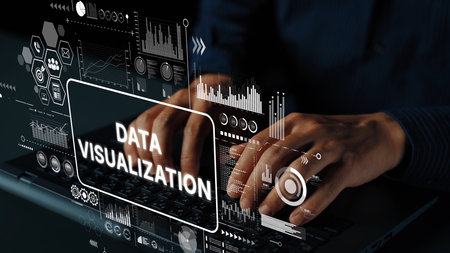 Hands Typing on Laptop with Data Visualization Graphics Representing Analytics and Information...