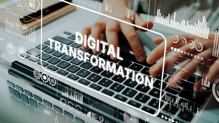 Hands on Laptop Keyboard with Digital Transformation Theme and Data Graphics Overlaying Image for Technology and Innovation Concepts. Asymptotic smart data analytic.の写真素材