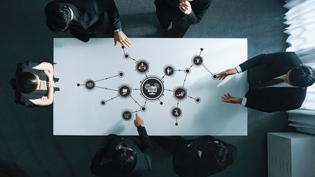 Strategic Business Meeting with Diverse Professionals Analyzing Data and Technology Concepts on...