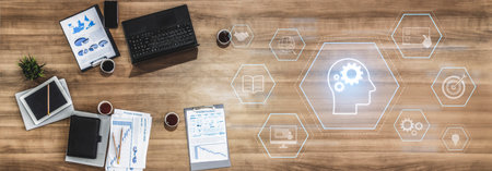 Head with gear and icons representing learning, digital training, and development process, showing skill growth for human or AI systems through knowledge or task optimizationの写真素材