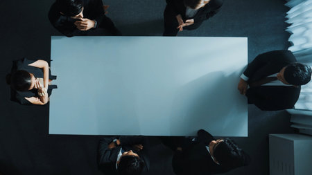Top down aerial view of smart cooperate businessman discussing about marketing strategy. Diverse...