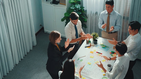 Top view of professional business team working together to brainstorm environmental idea by using mind map. Aerial view of smart manager talking and discussing about sustainable energy.の写真素材