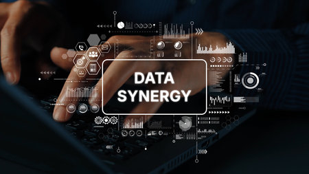Hands Typing on Keyboard with Data Synergy Concept Graphics Illustrating Digital Technology and Analytics. Asymptotic smart data analytic.の写真素材