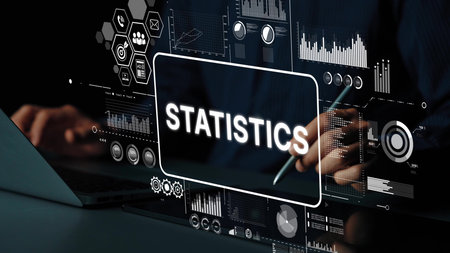 Business professional analyzing digital statistics data with modern technology in a dark office...