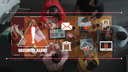 A dramatic security alert displayed in a modern office environment highlights teamwork and technology. Professionals engage in collaboration and strategy development. Rasterの写真素材